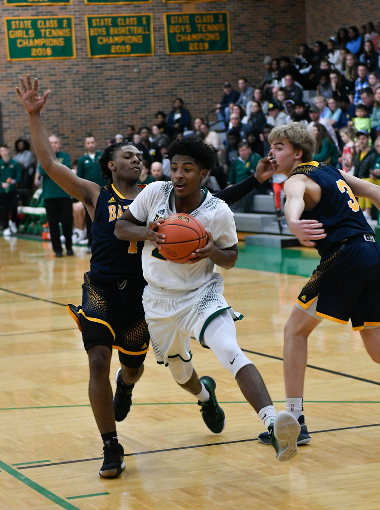 Rock Bridge senior guard Charles Wilson drives
